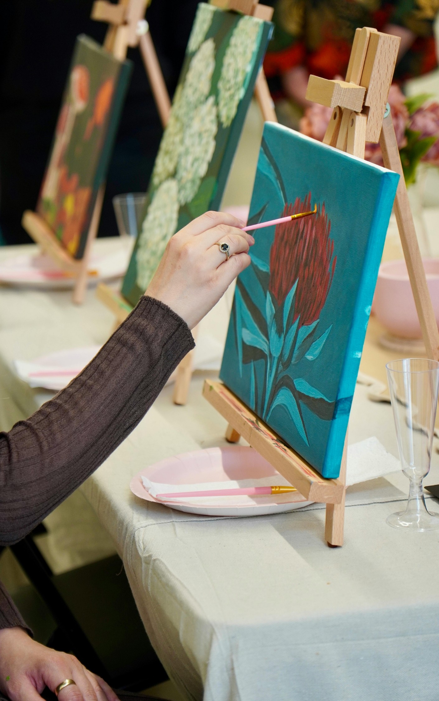 A resident painting during an art and enrichment activity